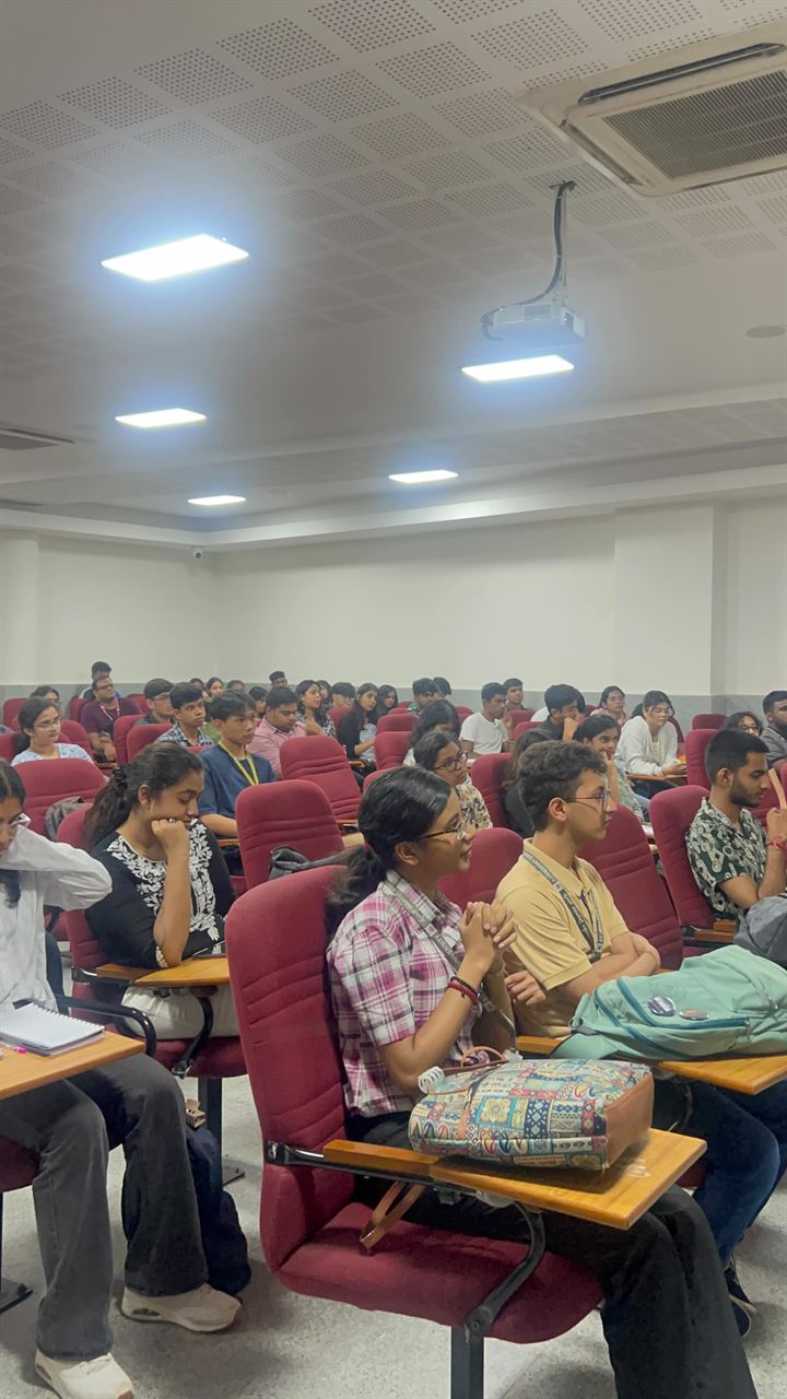 Epigram members listening during a debate training room