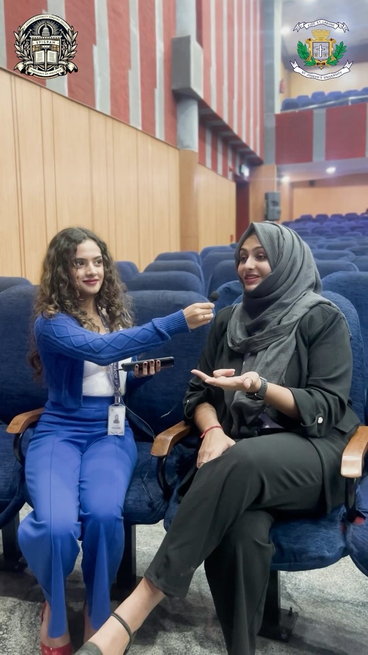 Airwaves interviewer recording a guest conversation in the auditorium