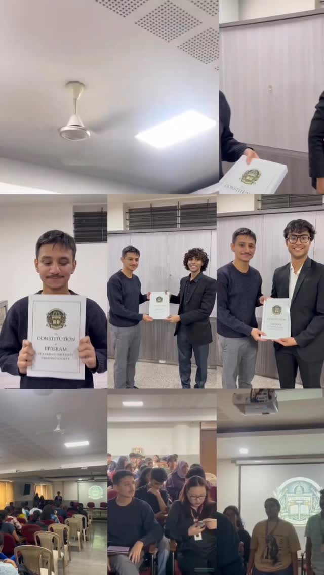 Epigram members holding the printed constitution